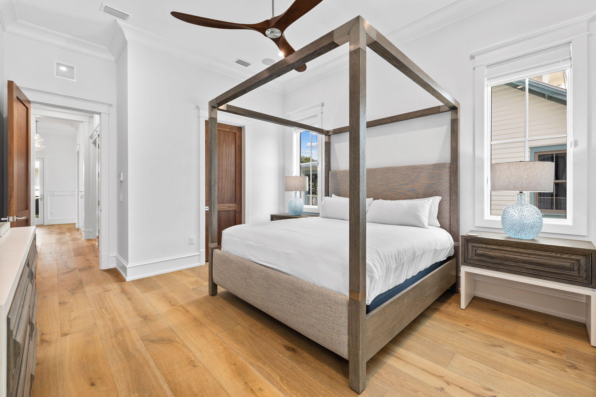 57 Azalea Street Santa Rosa Beach, FL 32459 - Photo 36 of 66 a bedroom with a bed table and a large mirror