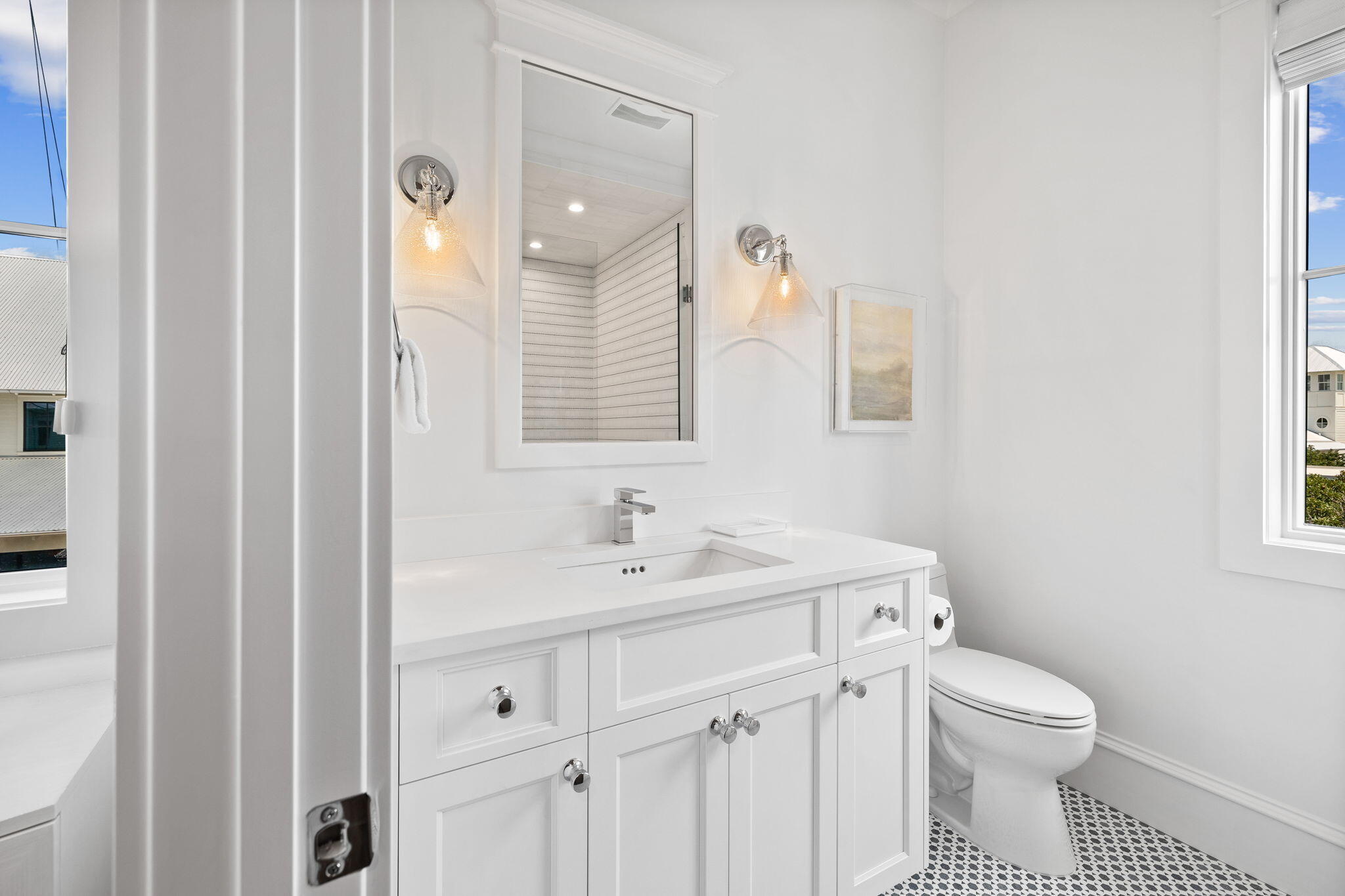 57 Azalea Street Santa Rosa Beach, FL 32459 - Photo 43 of 66 a bathroom with a sink a toilet and a mirror