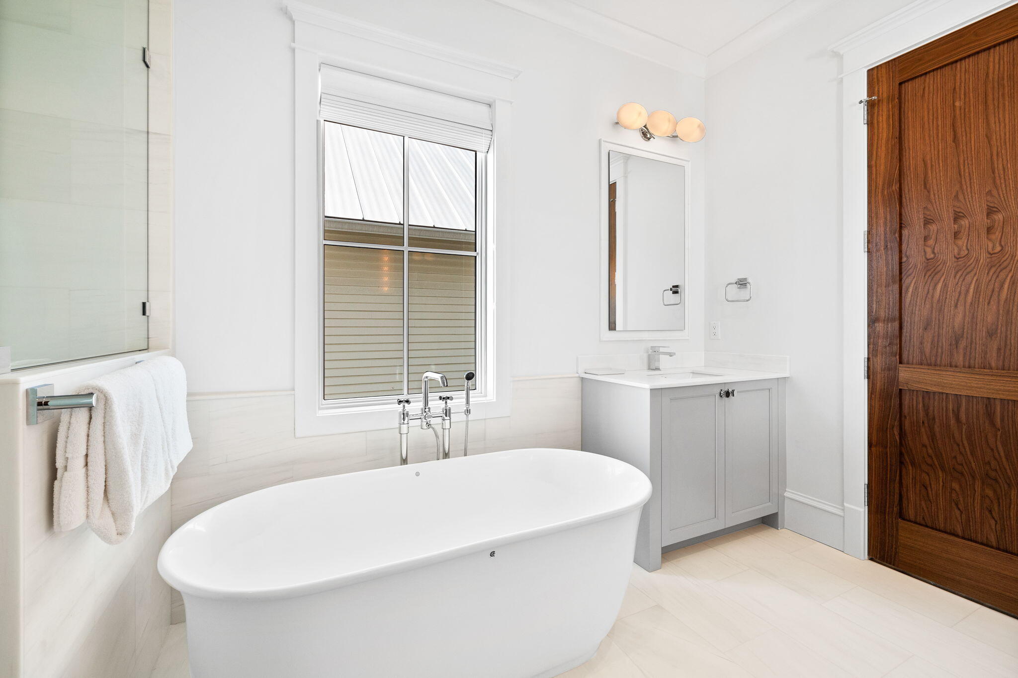 57 Azalea Street Santa Rosa Beach, FL 32459 - Photo 48 of 66 a bathroom with a sink a bathtub and a window