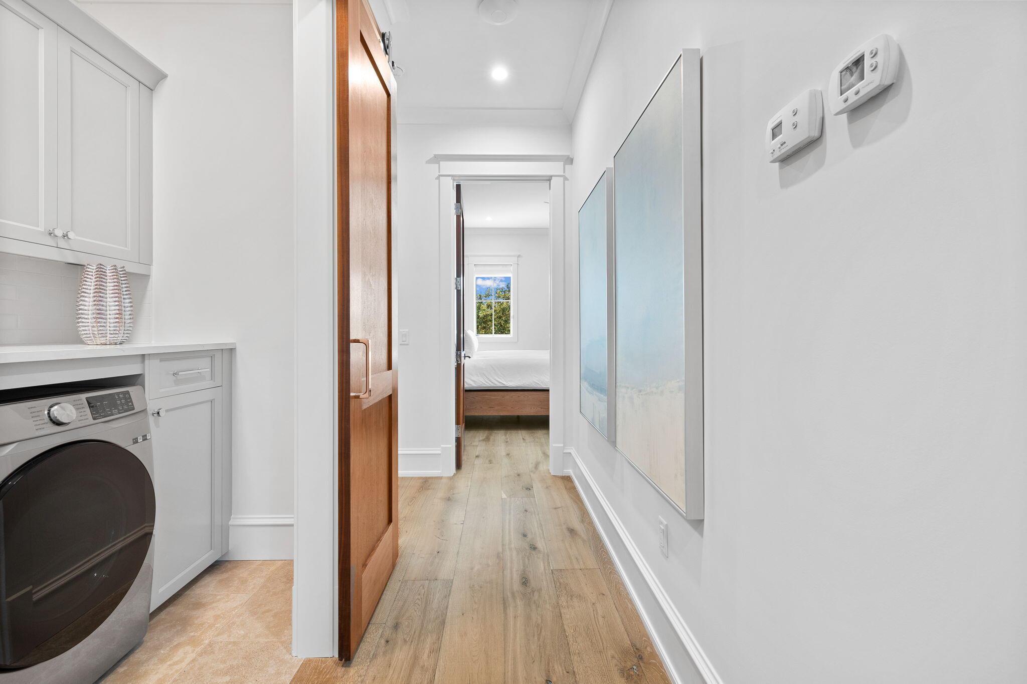 57 Azalea Street Santa Rosa Beach, FL 32459 - Photo 50 of 66 a view of a hallway with washer and dryer
