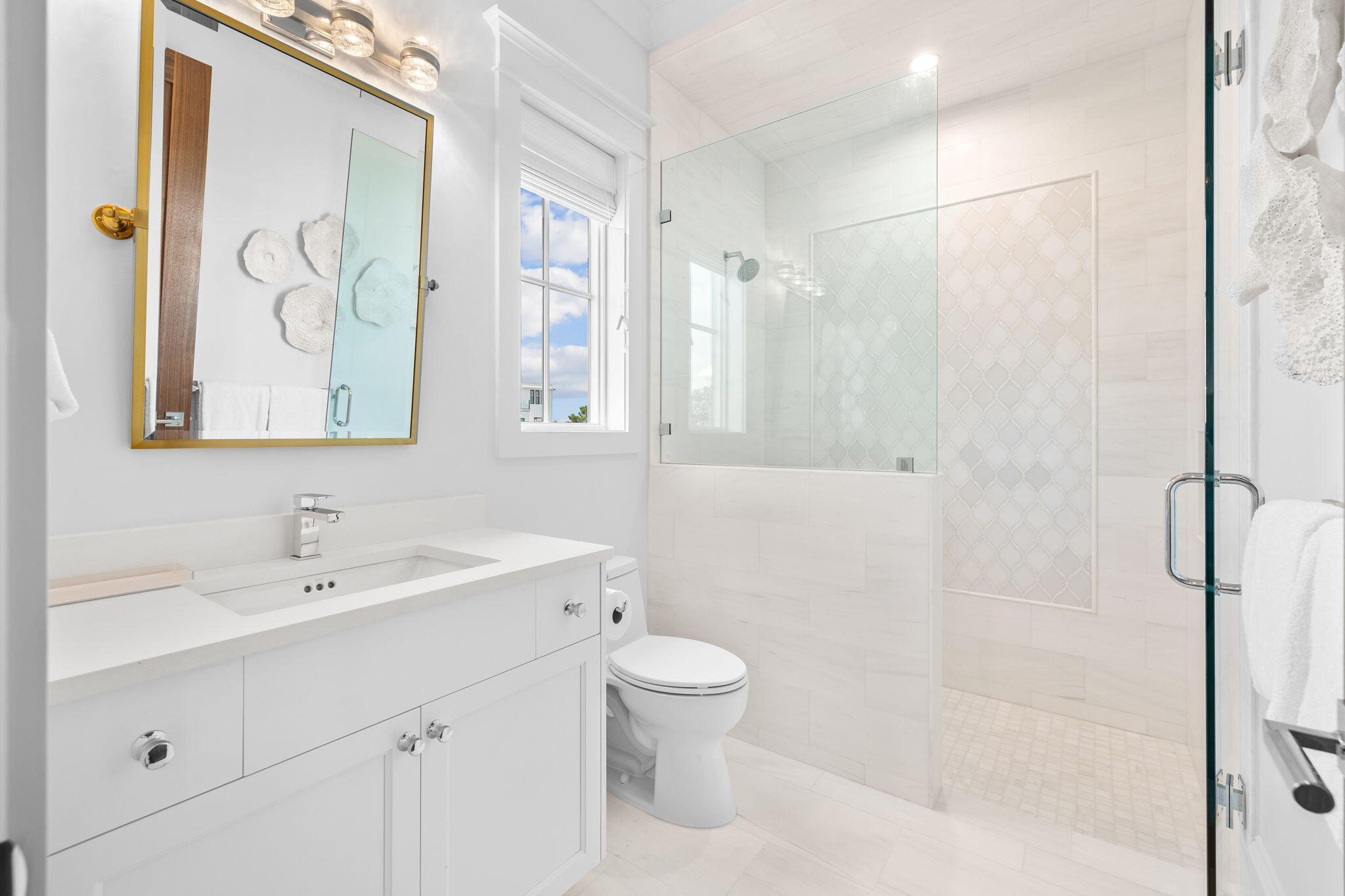 57 Azalea Street Santa Rosa Beach, FL 32459 - Photo 55 of 66 a bathroom with a toilet sink and shower