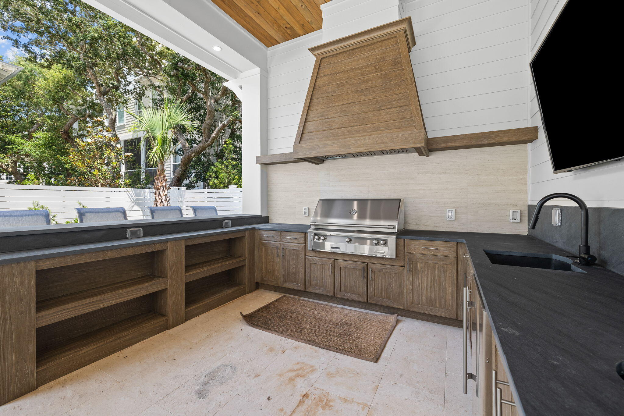 57 Azalea Street Santa Rosa Beach, FL 32459 - Photo 62 of 66 a kitchen with stainless steel appliances granite countertop a sink and a stove
