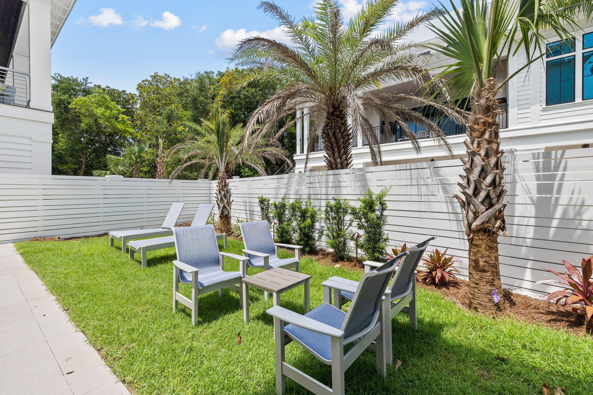 57 Azalea Street Santa Rosa Beach, FL 32459 - Photo 64 of 66 a backyard of a house with outdoor seating