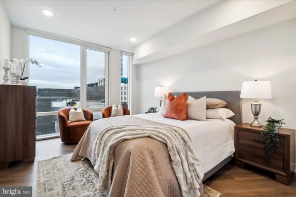 a bedroom with double bed and a lamp