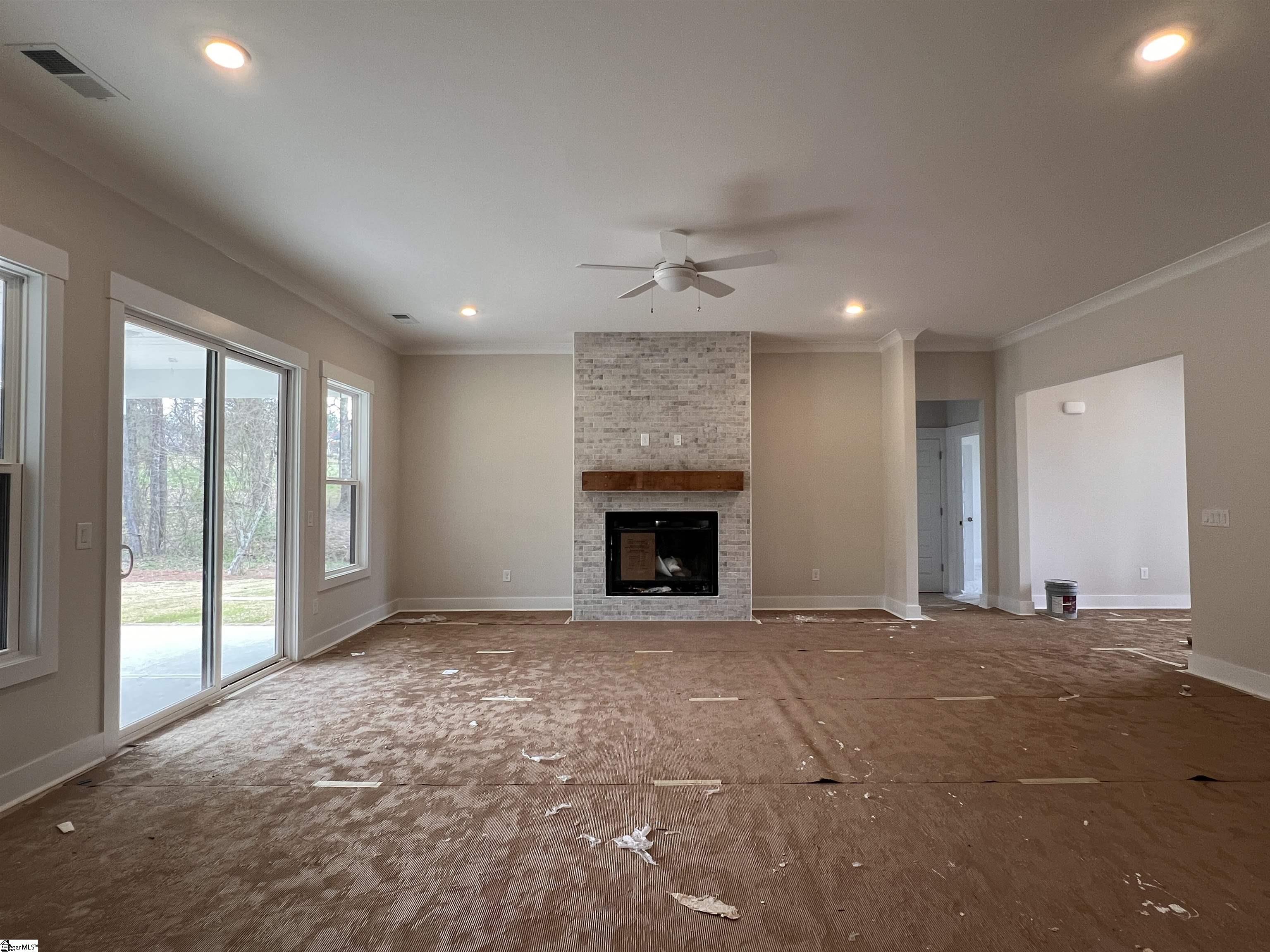 202 Timothy Court Anderson, SC 29621 - Photo 4 of 19 Living room featuring a gas burning fireplace with access to screened porch.