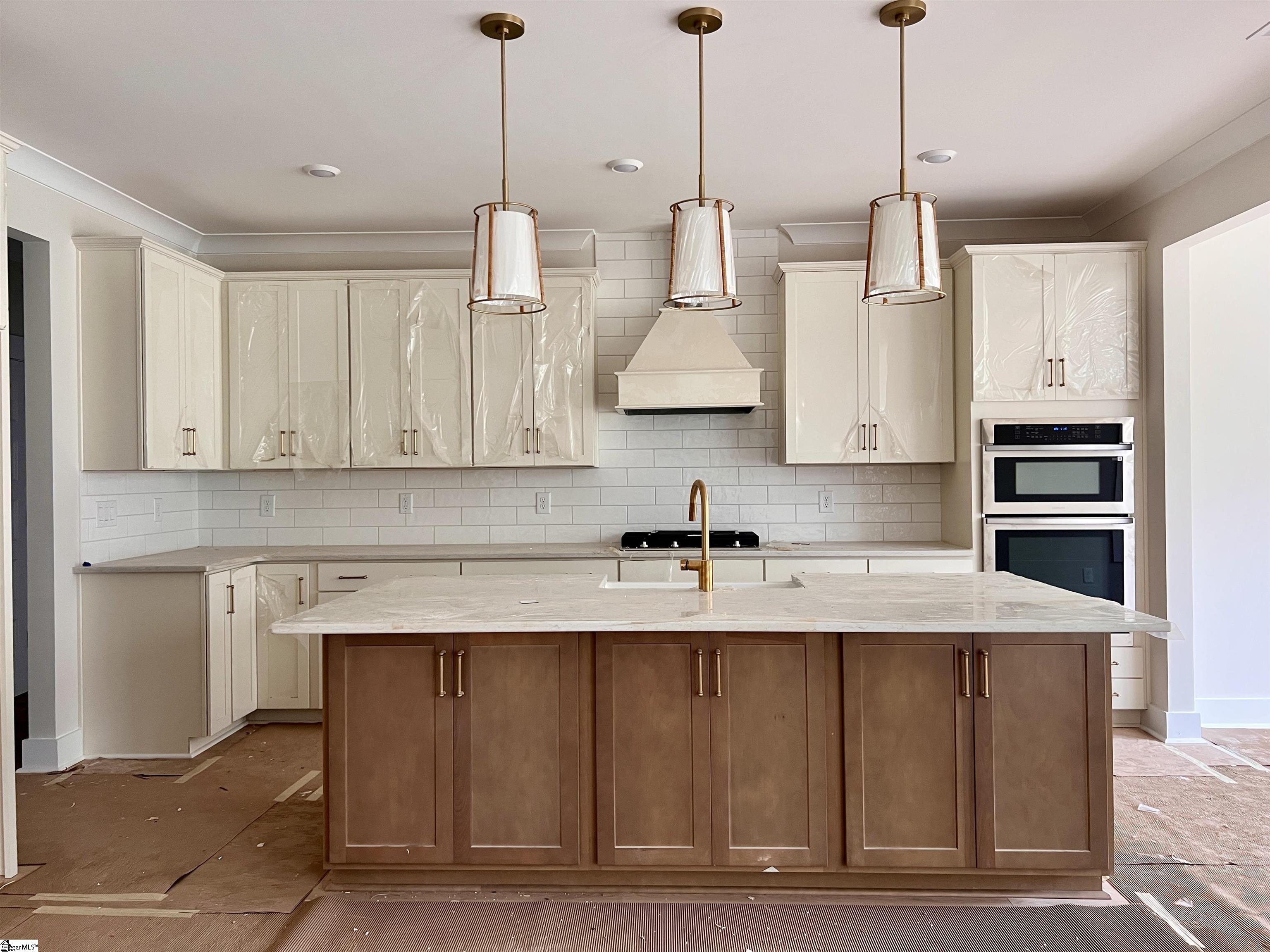 202 Timothy Court Anderson, SC 29621 - Photo 6 of 19 Gourmet kitchen with separate gas cooktop, hood, built in oven and microwave. Large island with double sided storage.