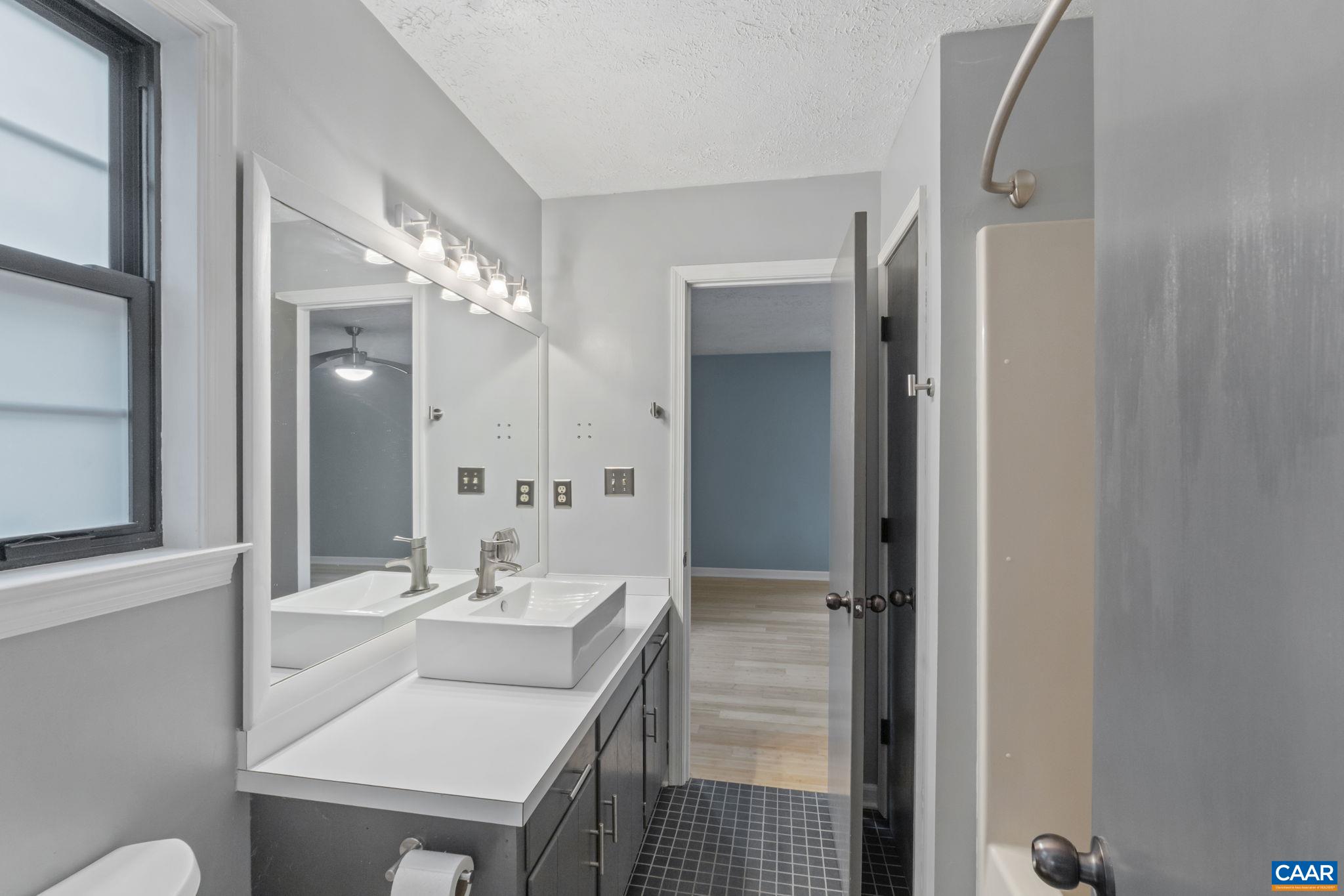 323 Jefferson Drive Palmyra, VA 22963 - Photo 16 of 27 a bathroom with a sink vanity and a mirror