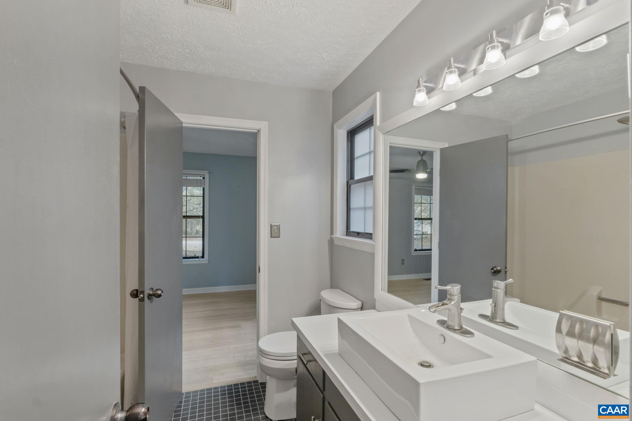 323 Jefferson Drive Palmyra, VA 22963 - Photo 19 of 27 a bathroom with a sink toilet and shower