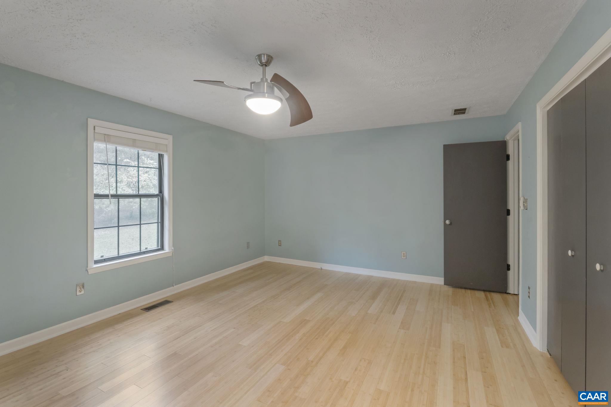323 Jefferson Drive Palmyra, VA 22963 - Photo 20 of 27 wooden floor in an empty room with a window
