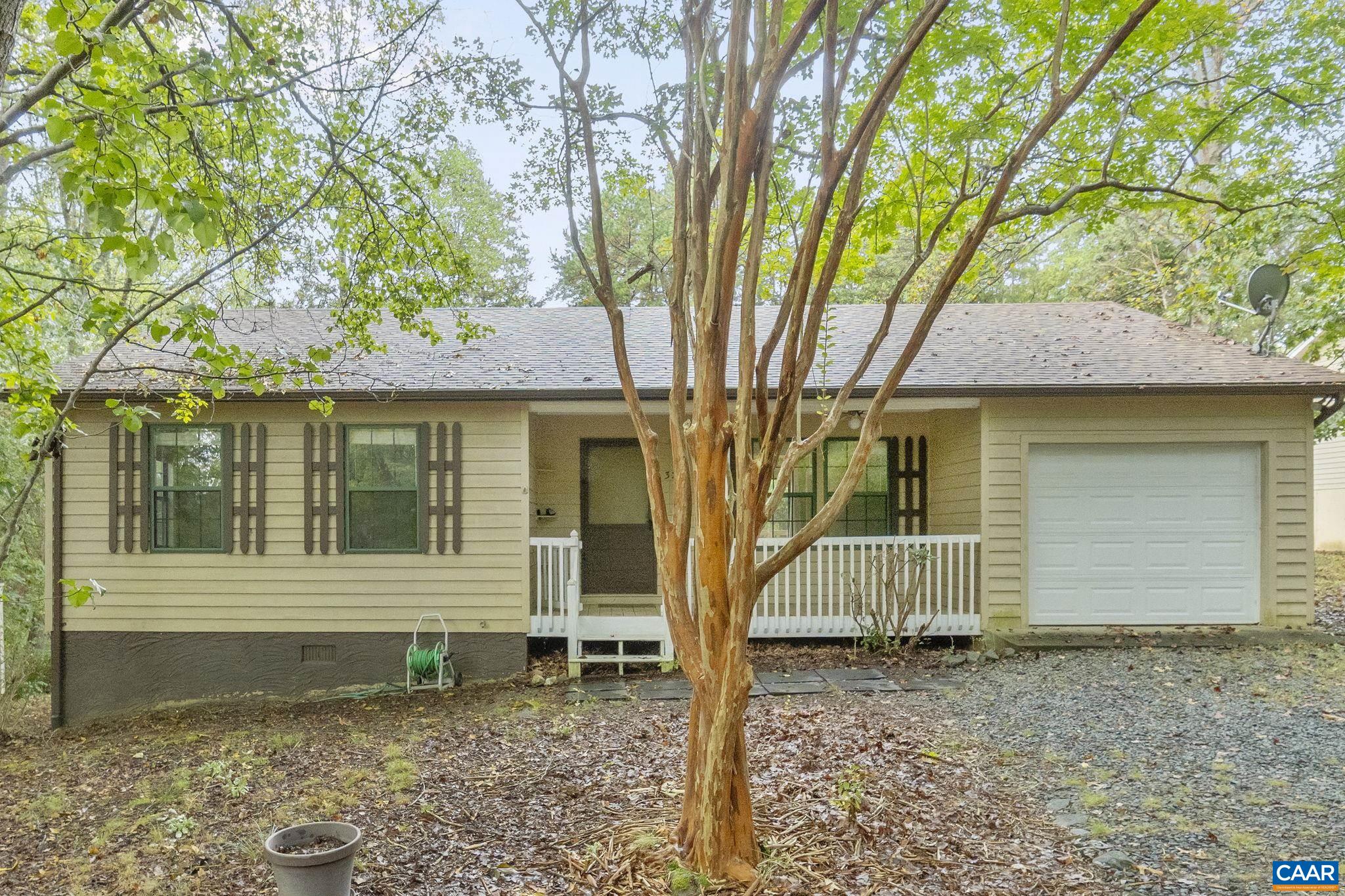 323 Jefferson Drive Palmyra, VA 22963 - Photo 4 of 27 a front view of a house with a yard and porch