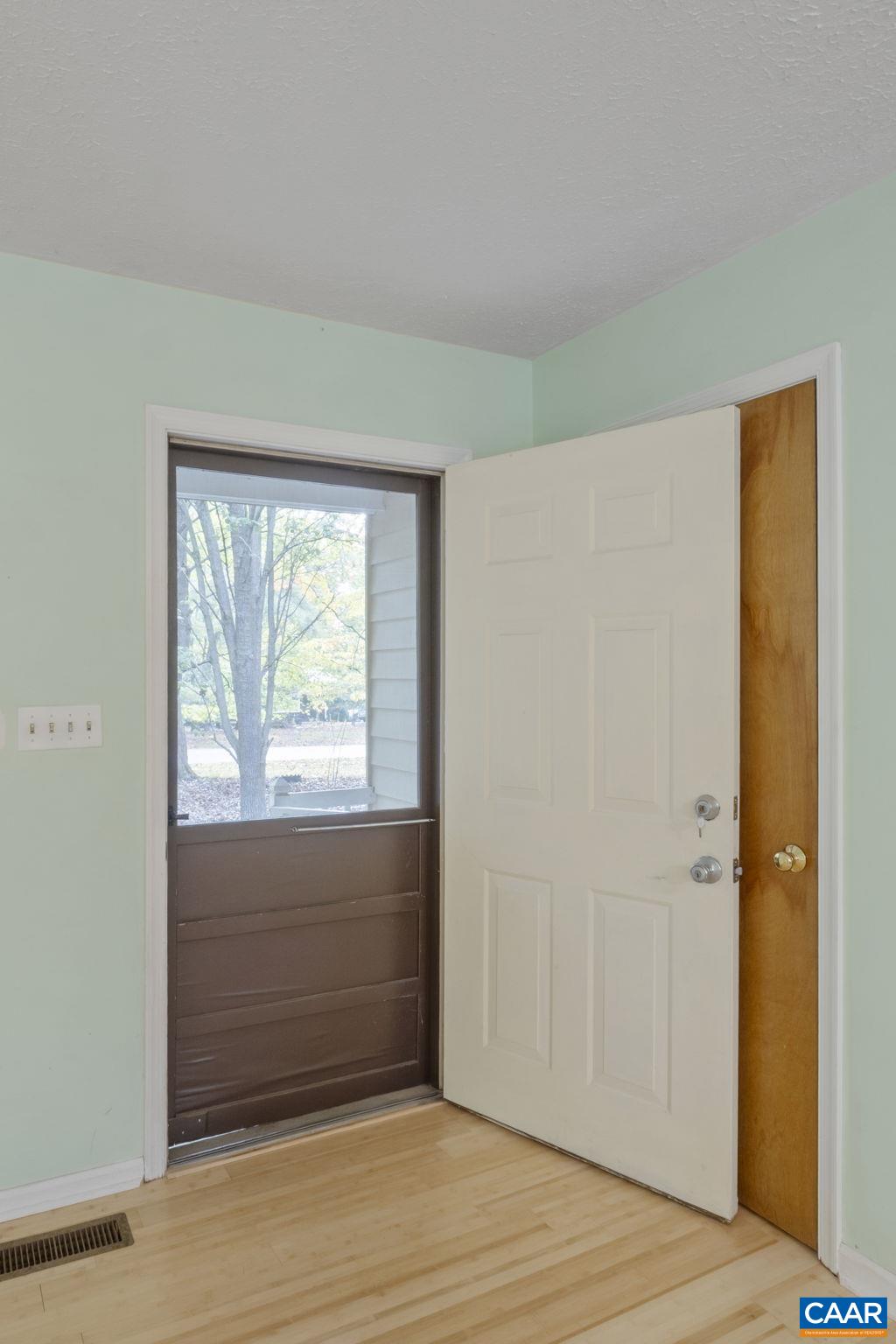 323 Jefferson Drive Palmyra, VA 22963 - Photo 7 of 27 a view of an empty room with wooden floor and a window