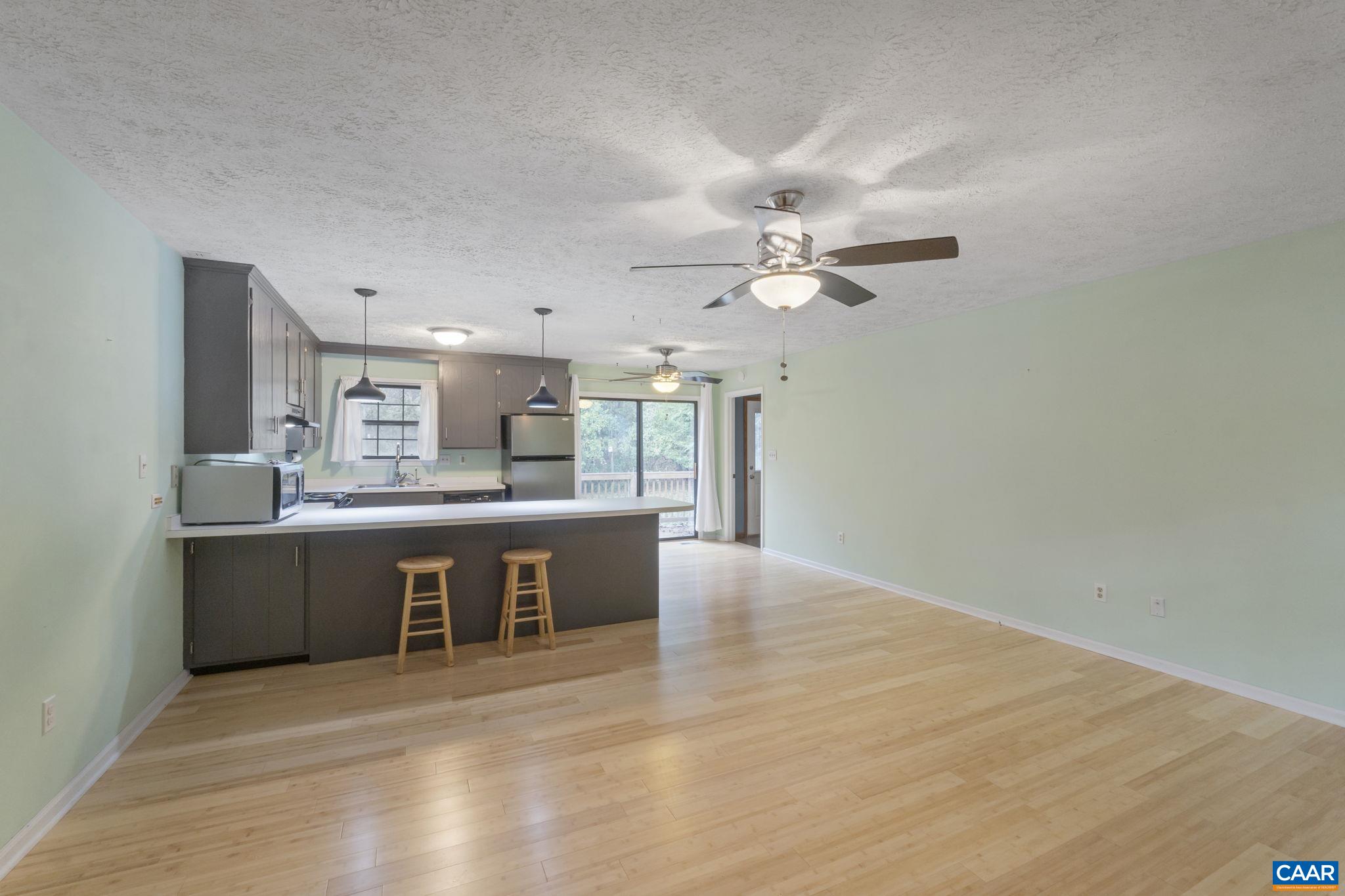323 Jefferson Drive Palmyra, VA 22963 - Photo 8 of 27 a view of kitchen with granite countertop cabinets and refrigerator