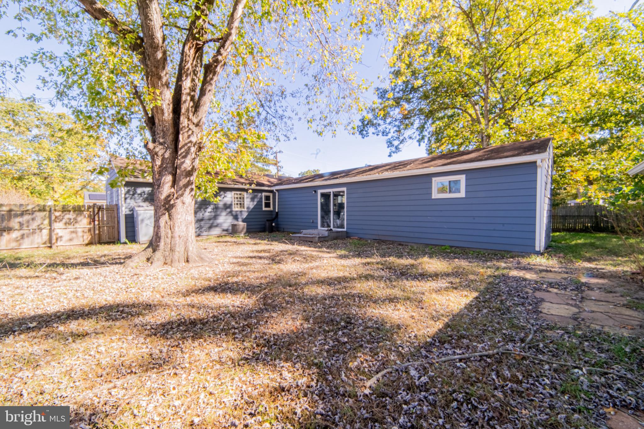 519 Berkeley Drive Browns Mills, NJ 08015 - Photo 14 of 25 a backyard of a house with large trees
