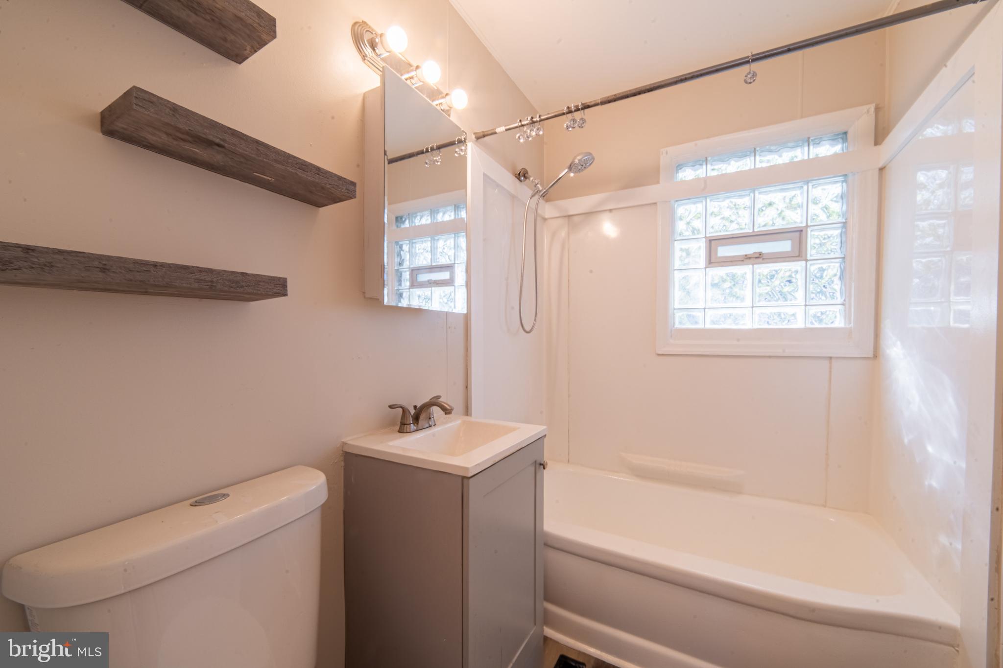 519 Berkeley Drive Browns Mills, NJ 08015 - Photo 15 of 25 a bathroom with a sink a toilet and shower