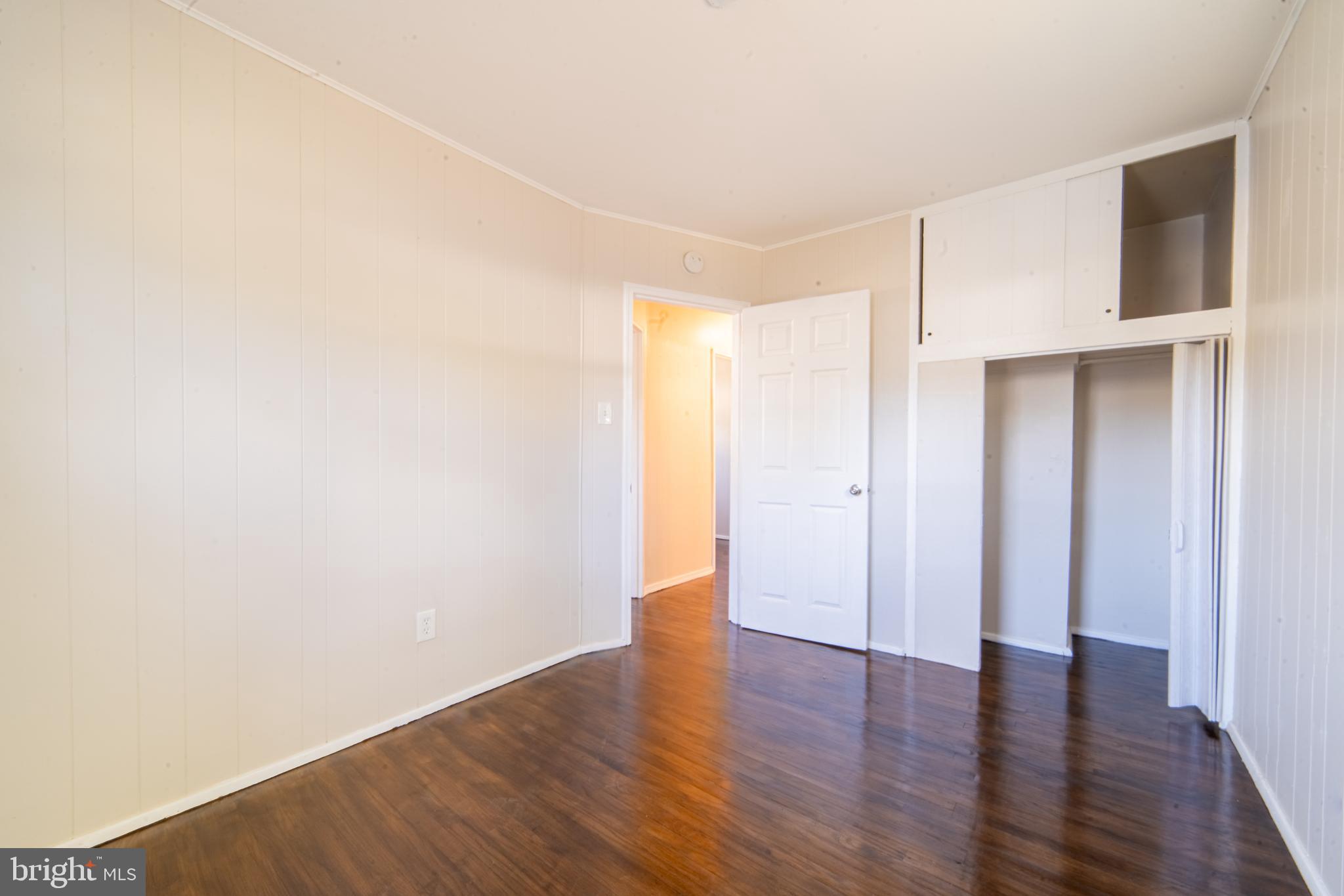 519 Berkeley Drive Browns Mills, NJ 08015 - Photo 19 of 25 a view of an empty room with wooden floor