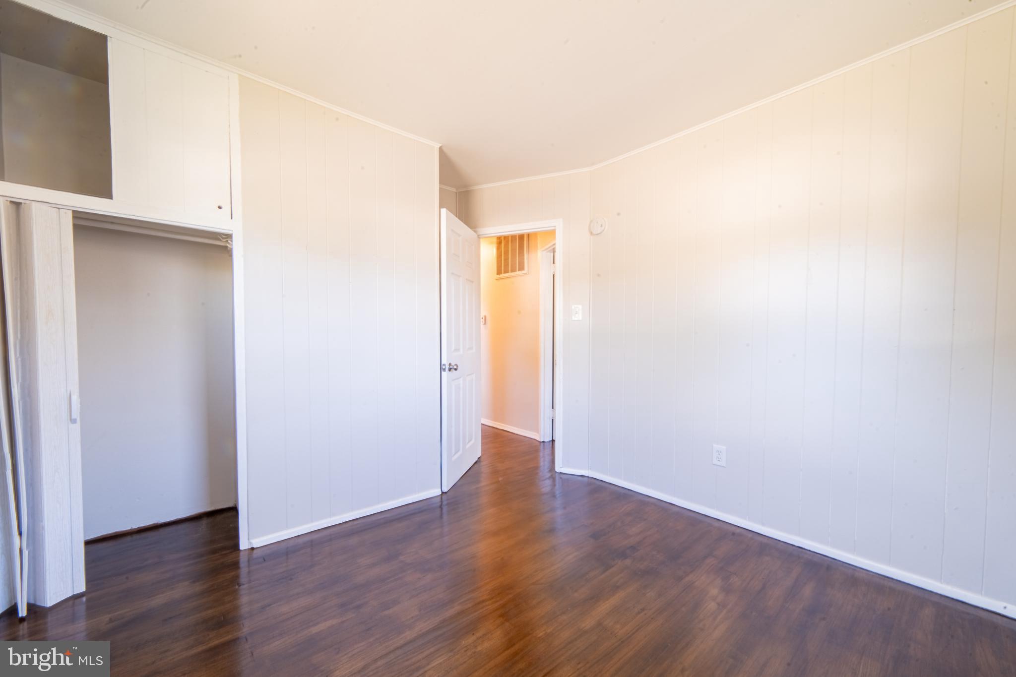 519 Berkeley Drive Browns Mills, NJ 08015 - Photo 21 of 25 a view of an empty room with wooden floor
