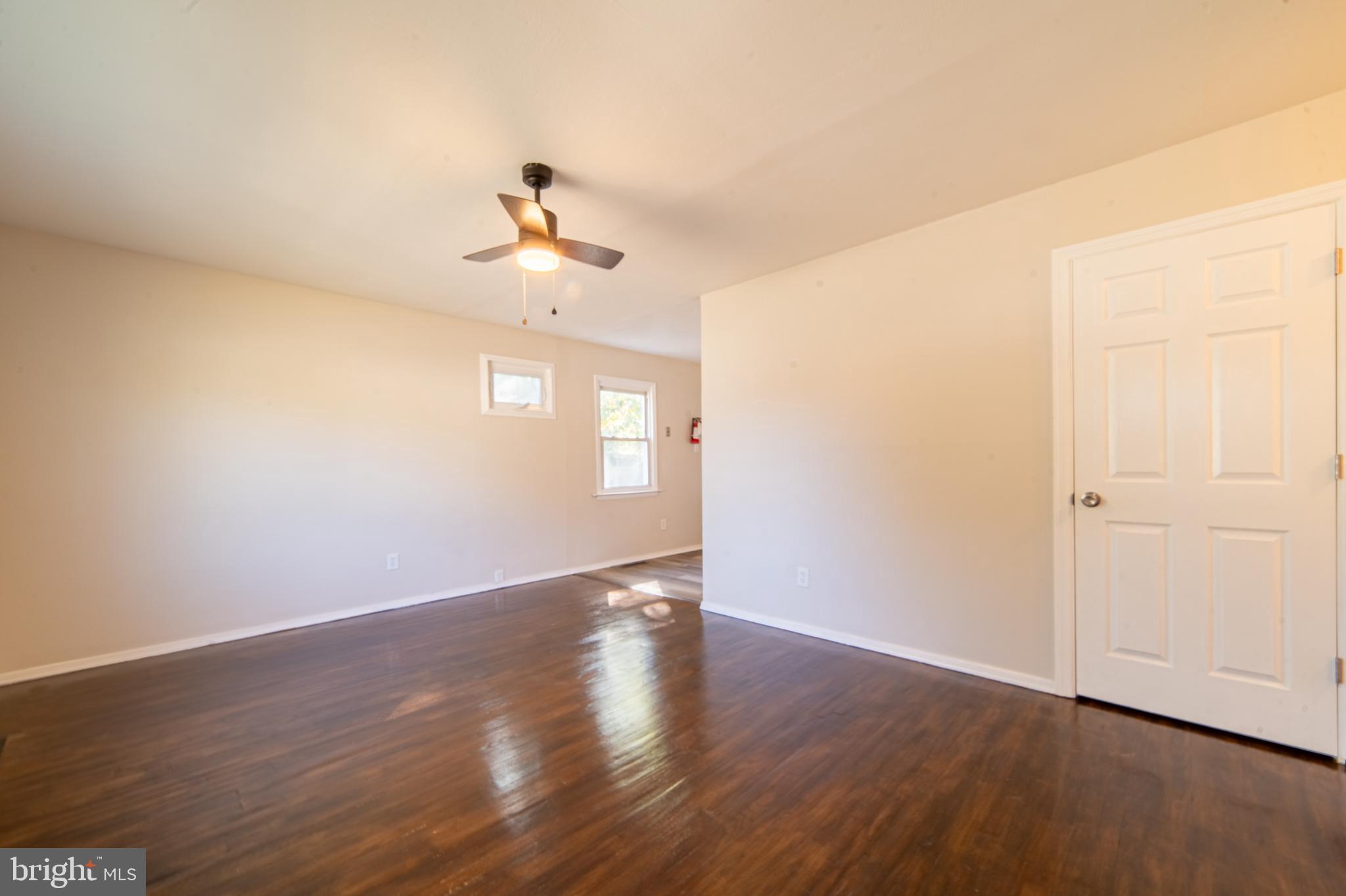 519 Berkeley Drive Browns Mills, NJ 08015 - Photo 6 of 25 a view of a room with wooden floor and ceiling fan