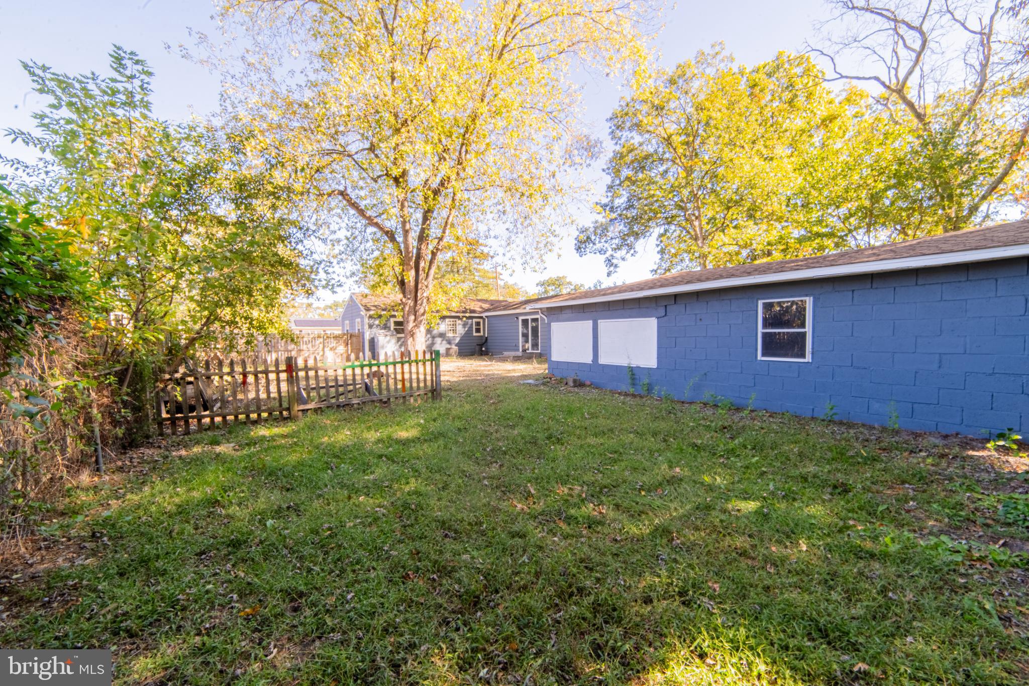 519 Berkeley Drive Browns Mills, NJ 08015 - Photo 7 of 25 a view of a backyard with a large tree