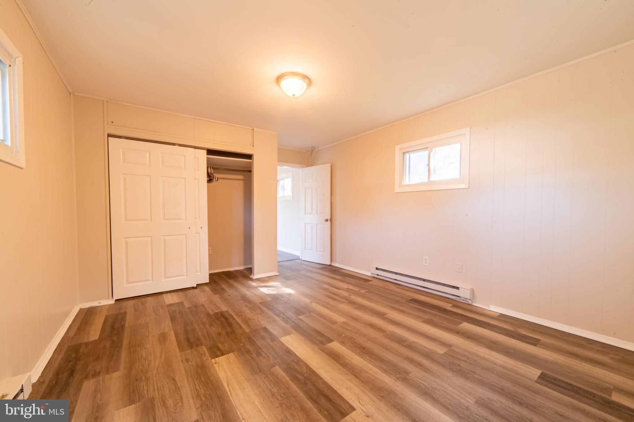 519 Berkeley Drive Browns Mills, NJ 08015 - Photo 10 of 25 a view of an empty room and wooden floor