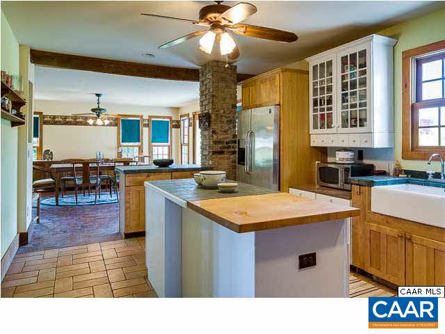 573 Stage Junction Road Columbia, VA 23038 - Photo 8 of 44 a open kitchen with stainless steel appliances granite countertop a sink and cabinets