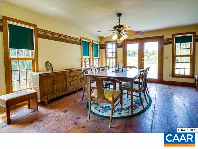 573 Stage Junction Road Columbia, VA 23038 - Photo 10 of 44 a living room with furniture a large window and wooden floor