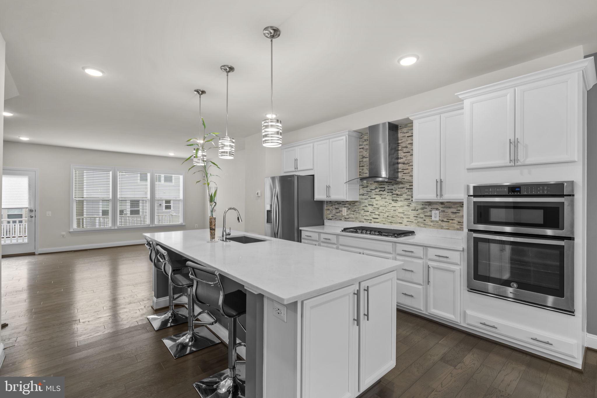 17357 Redshank Road Dumfries, VA 22026 - Photo 12 of 29 a kitchen with a stove a sink and a refrigerator