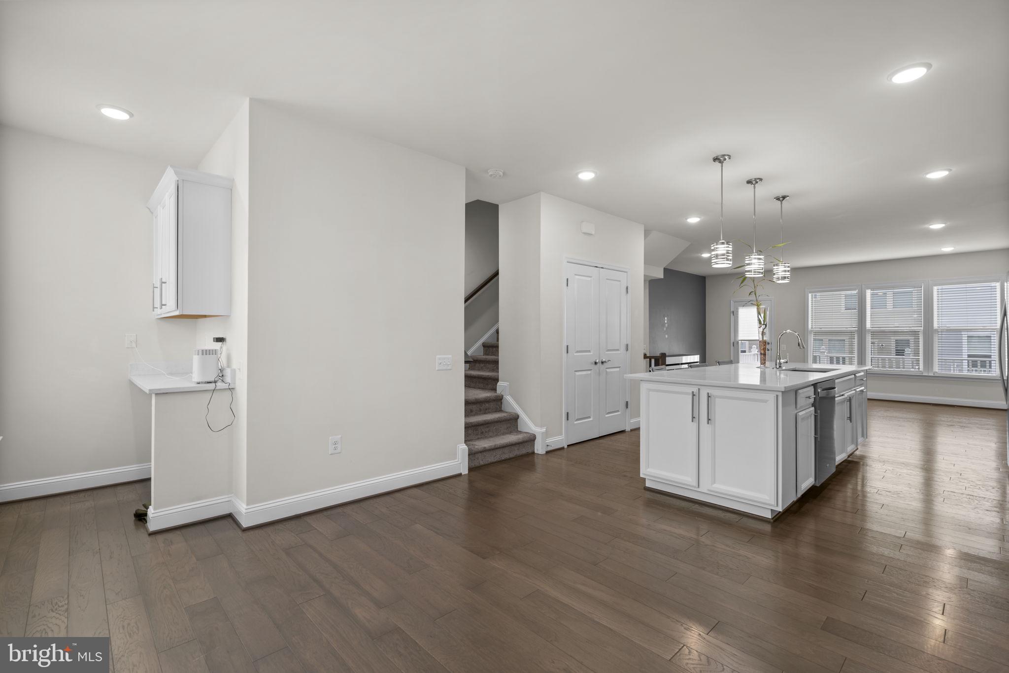 17357 Redshank Road Dumfries, VA 22026 - Photo 16 of 29 a view of kitchen with wooden floor and electronic appliances