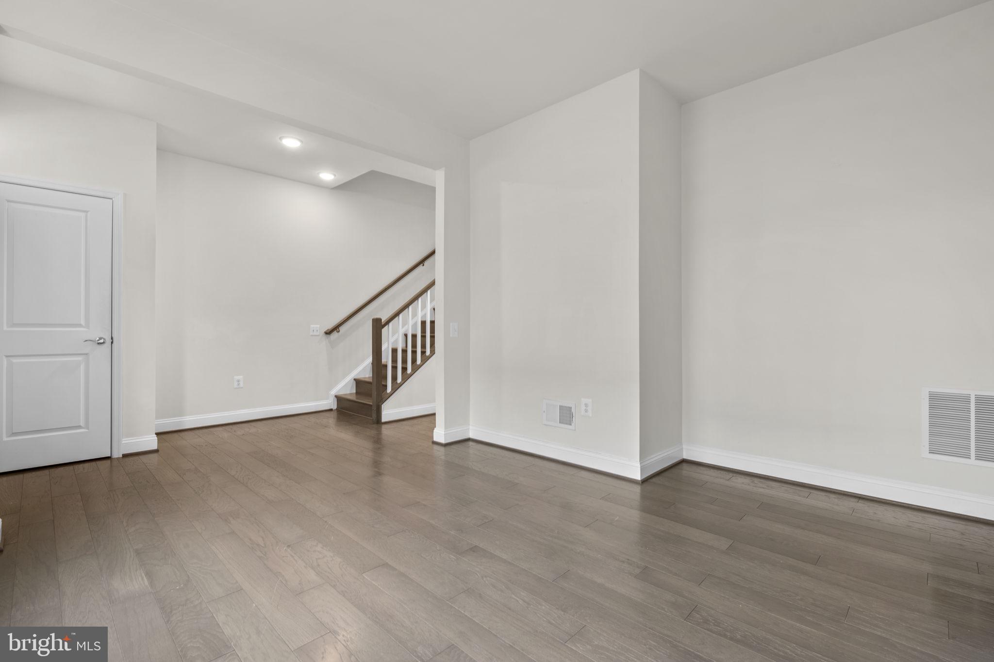 17357 Redshank Road Dumfries, VA 22026 - Photo 2 of 29 a view of an empty room with wooden floor