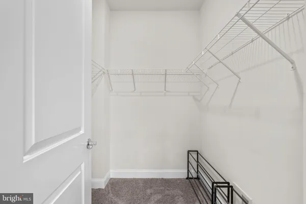 a view of a hallway with staircase