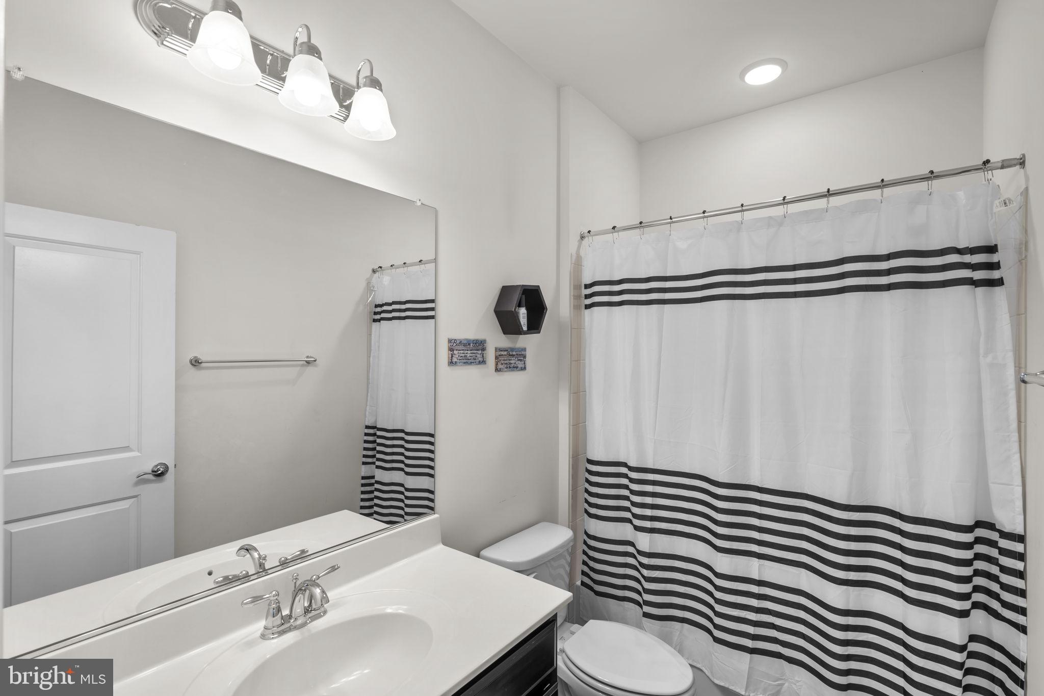 17357 Redshank Road Dumfries, VA 22026 - Photo 25 of 29 a bathroom with a sink and mirror