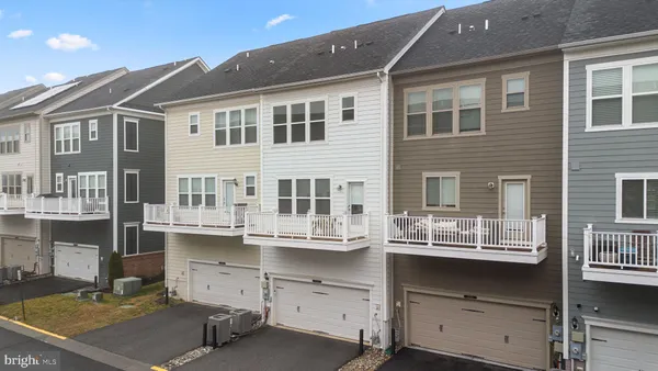 a view of a house with a balcony and wooden floor
