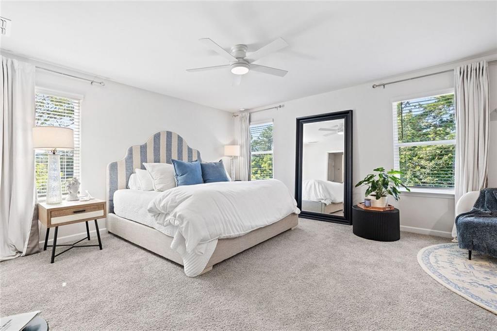 4167 Waratah Way Mableton, GA 30126 - Photo 14 of 32 a bed room with a bed and a chair