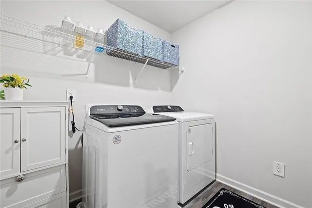 a utility room with dryer and washer