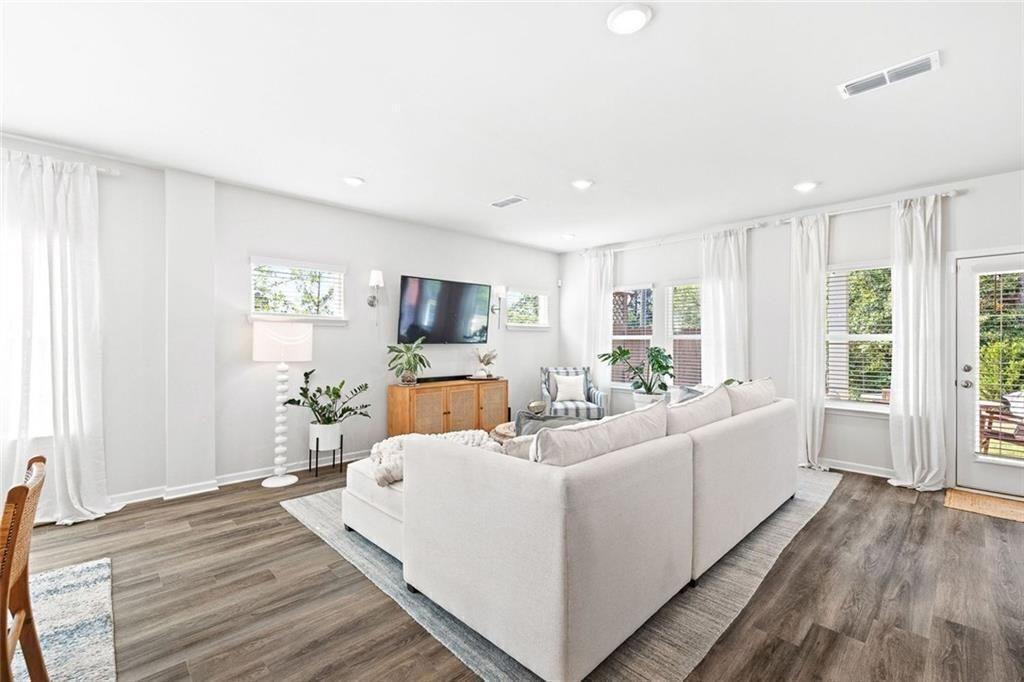 4167 Waratah Way Mableton, GA 30126 - Photo 4 of 32 a living room with furniture and a flat screen tv