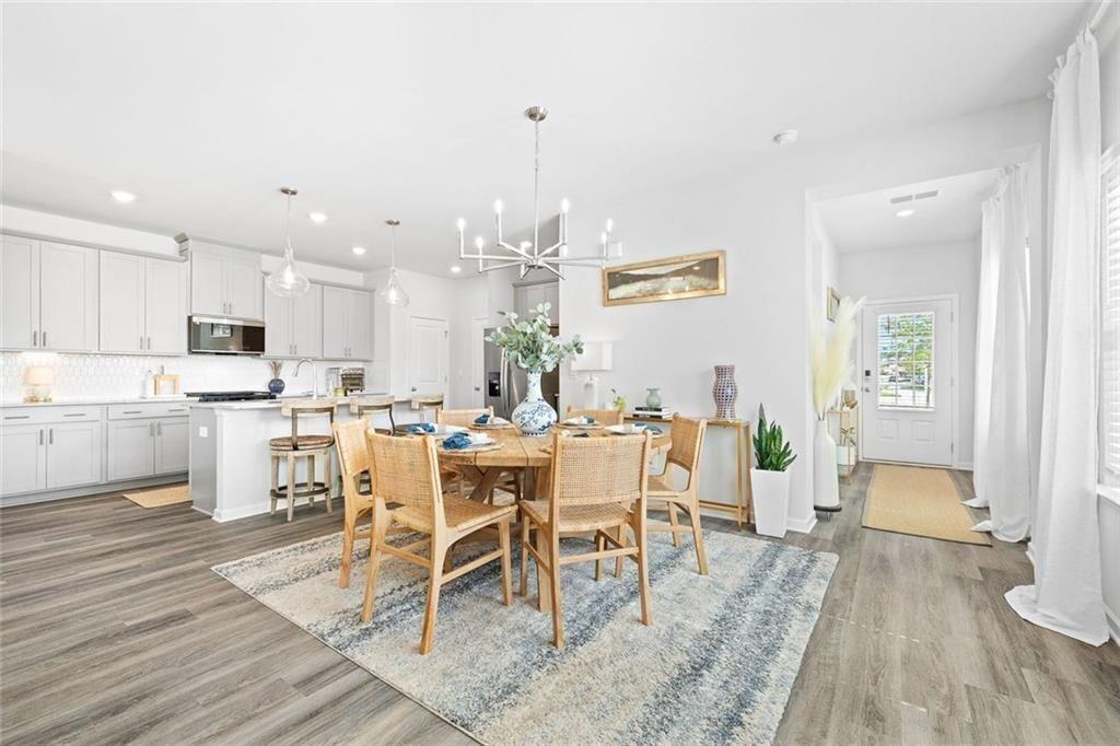 4167 Waratah Way Mableton, GA 30126 - Photo 7 of 32 a view of a dining room with furniture