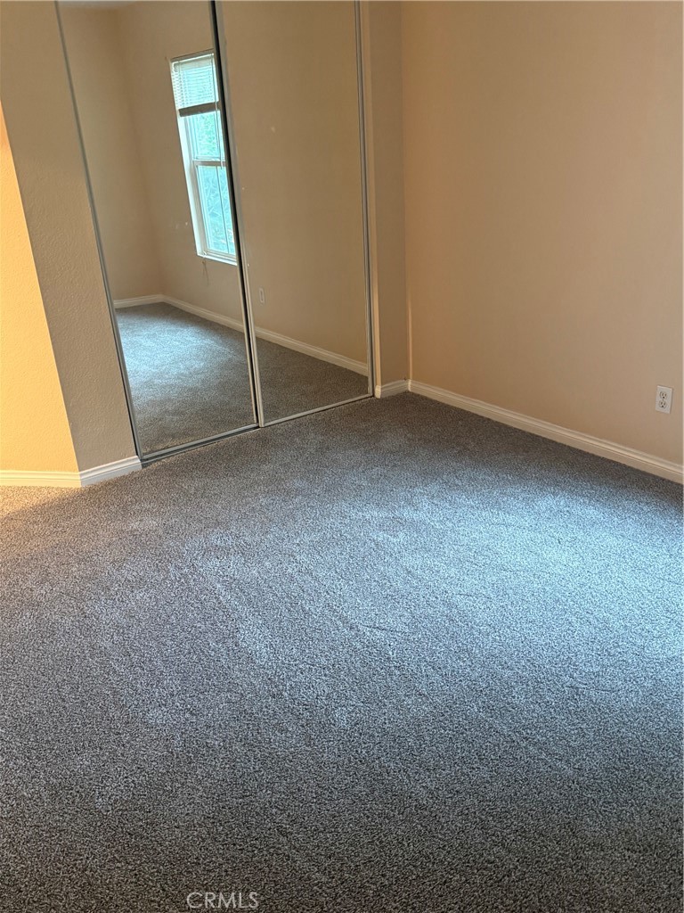 4420 Kristen Court Riverside, CA 92501 - Photo 30 of 39 SECONDARY BEDRROOM WITH MIRROWED CLOSET DOORS