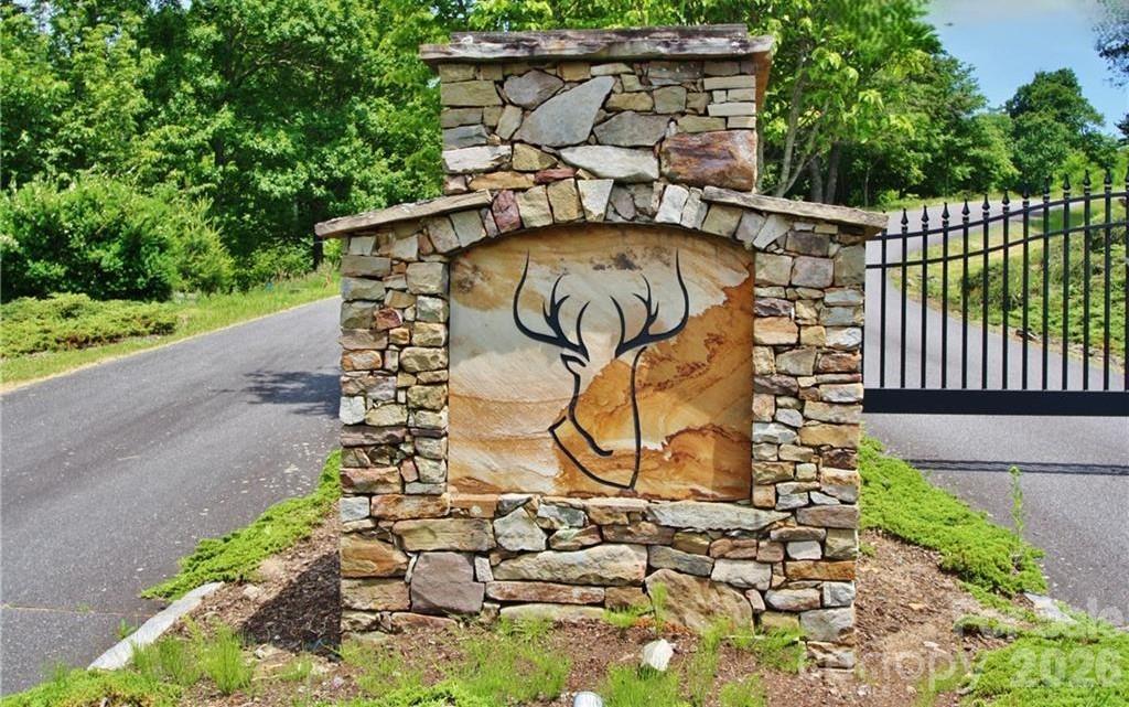 Tbd Wapiti Way, Unit 5 Boone, NC 28607 - Photo 12 of 13 a view of a staircase with wooden fence