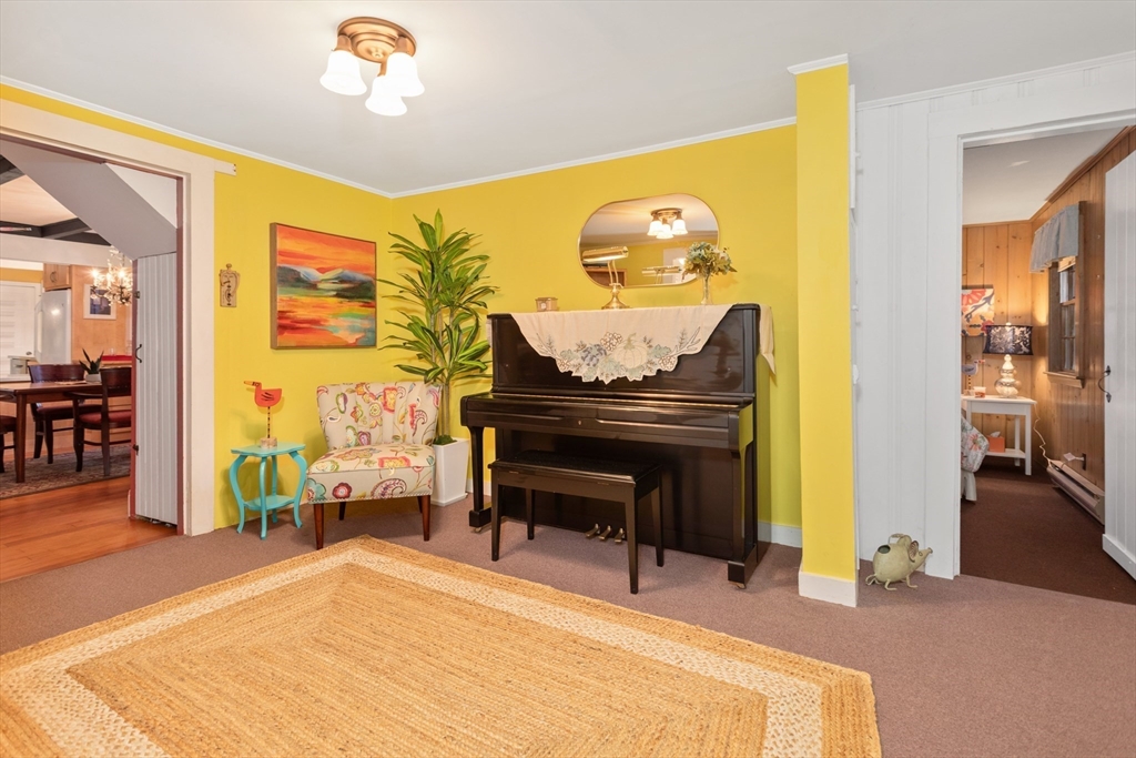 26 Coggeshall Road Gloucester, MA 01930 - Photo 12 of 37 a living room with furniture and a wooden floor