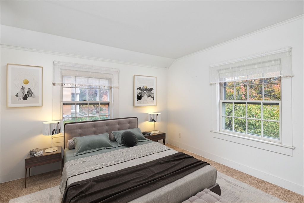 26 Coggeshall Road Gloucester, MA 01930 - Photo 21 of 37 a bedroom with furniture and a window