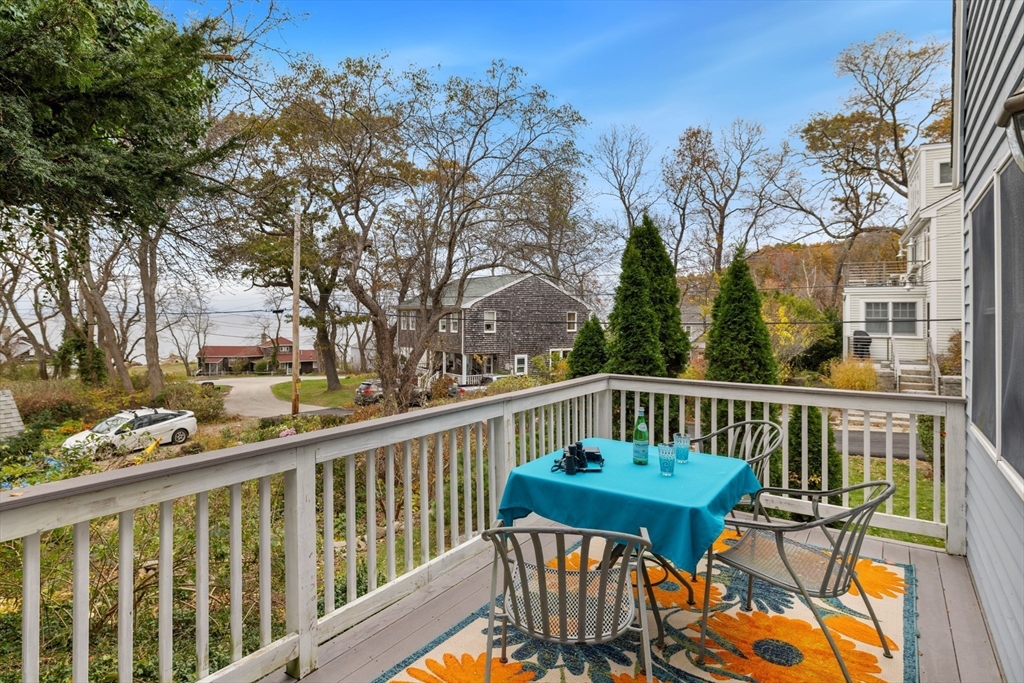 26 Coggeshall Road Gloucester, MA 01930 - Photo 22 of 37 a view of a two chairs on the deck