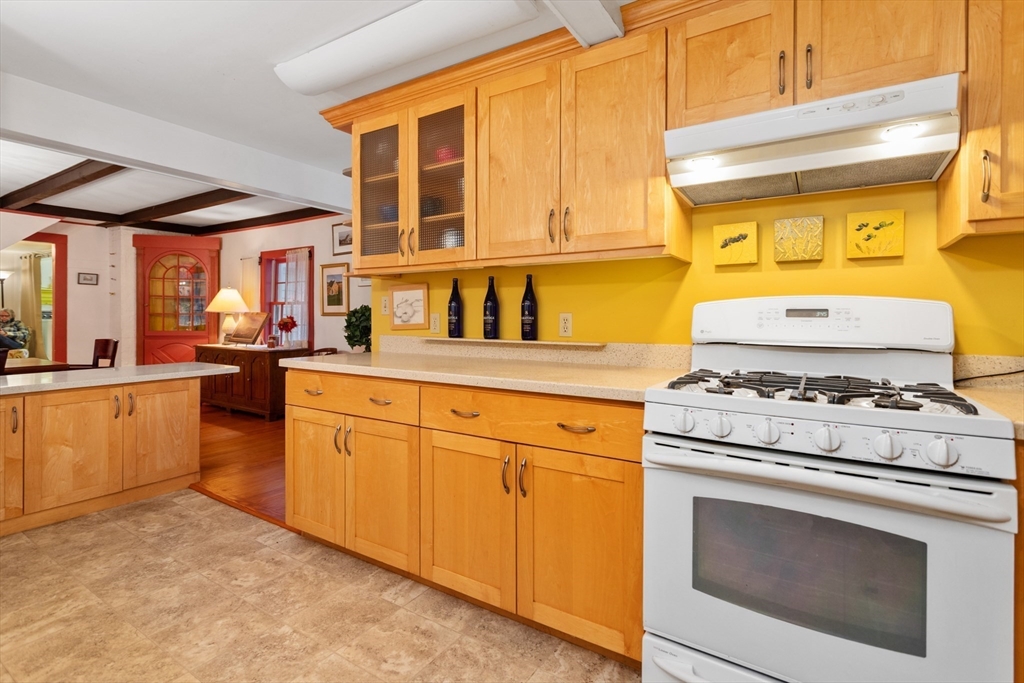 26 Coggeshall Road Gloucester, MA 01930 - Photo 7 of 37 a kitchen with stainless steel appliances granite countertop a stove and a sink