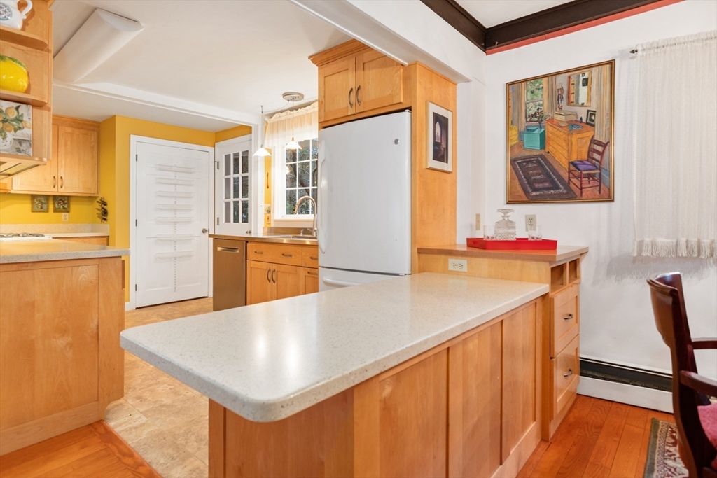 26 Coggeshall Road Gloucester, MA 01930 - Photo 8 of 37 a kitchen with stainless steel appliances granite countertop a refrigerator a stove and a refrigerator