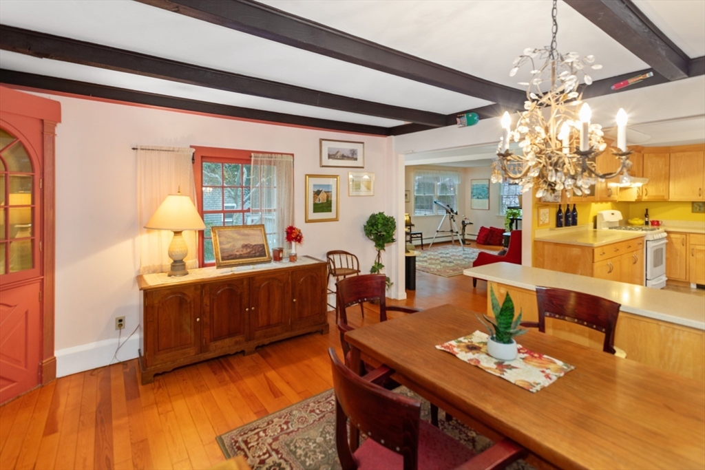 26 Coggeshall Road Gloucester, MA 01930 - Photo 9 of 37 a living room with furniture and a chandelier