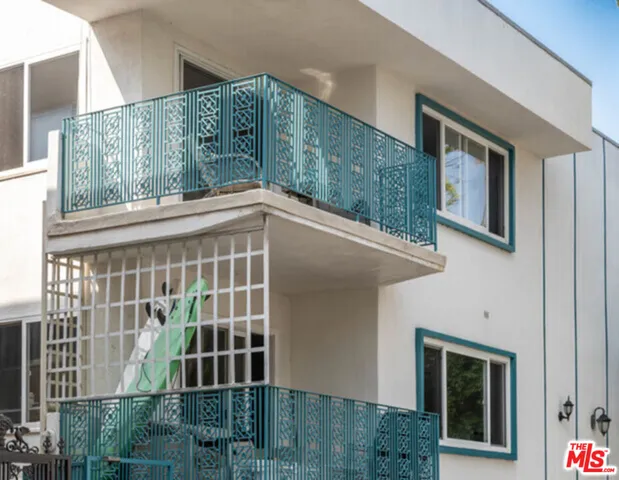a front view of a house with large windows