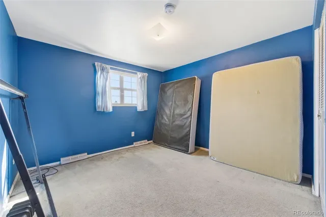 a view of empty room with windows