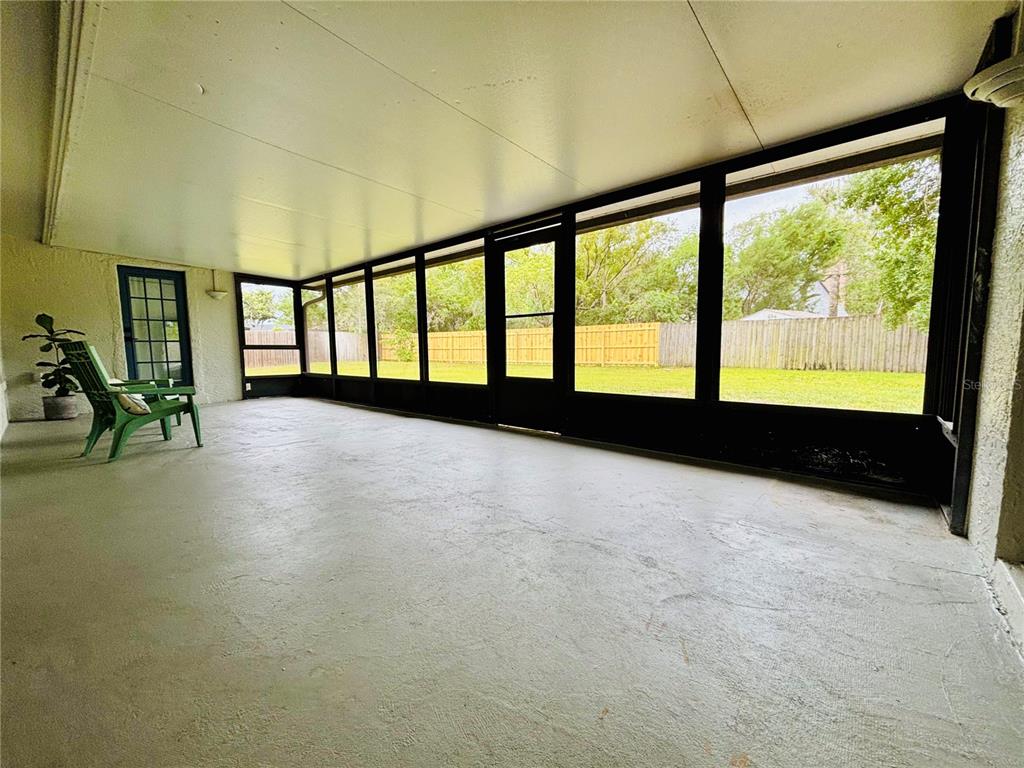 1045 Shaffer Trail Oviedo, FL 32765 - Photo 21 of 30 a view of an empty room with a window