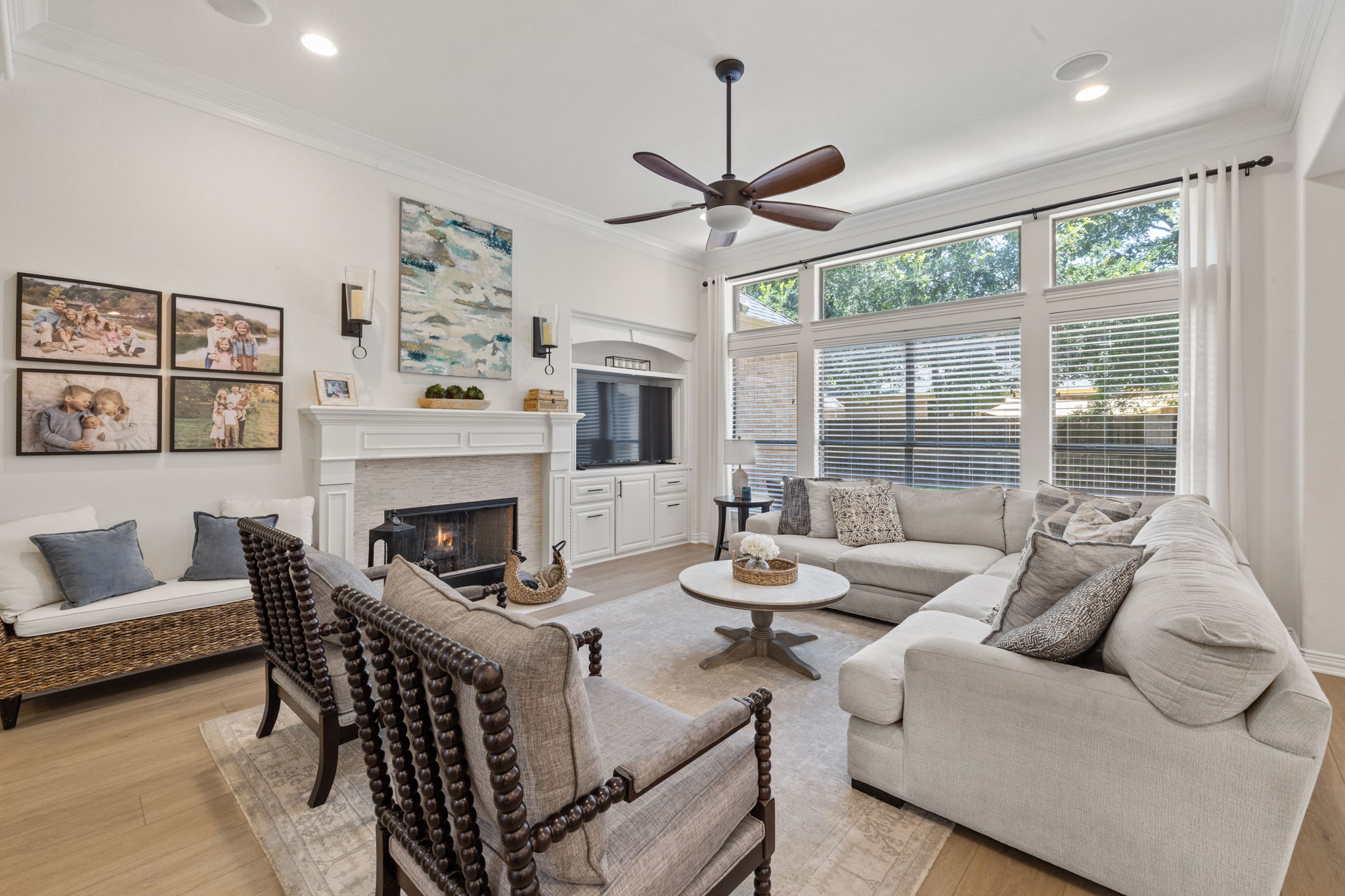 1124 Castle Path Round Rock, TX 78681 - Photo 15 of 40 A comforting living space features a tiled fireplace, abundant natural light, and classic architectural detailing.