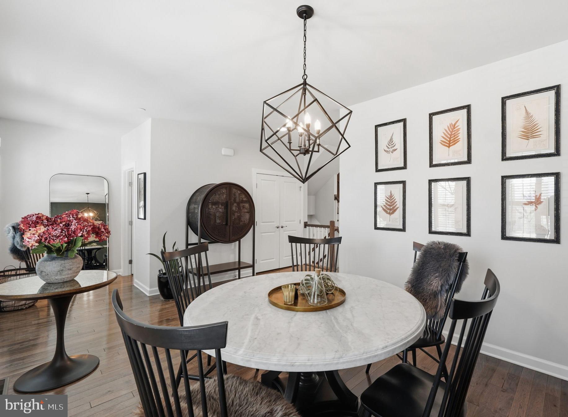 17812 Thomas Village Lane Sandy Spring, MD 20860 - Photo 13 of 37 a view of a dining room with furniture and chandelier