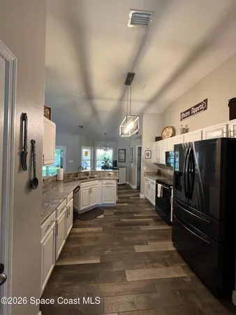 a large kitchen with cabinets