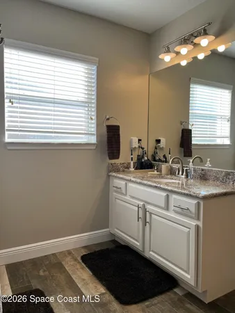 a kitchen with a sink cabinets and a window